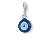Blue evil eye charm with a clasp on a white background