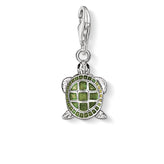 Green turtle charm with silver details on a white background
