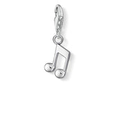 Silver music note charm on a white background