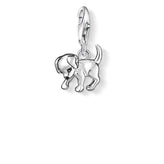 Silver dog charm on a white background