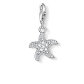 Starfish charm with clear stones on a white background