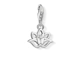 Silver lotus flower charm with a clear gemstone on a white background