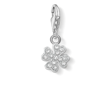 Silver clover-shaped charm with clear stones on a white background