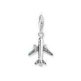 Silver airplane charm with colorful gemstones on a white background