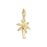 Gold palm tree charm on a white background