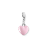 Pink heart-shaped charm with a clasp on a white background