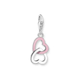 Heart-shaped silver and pink enamel charm on a white background