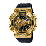 Gold Casio G-Shock watch with black strap on a white background
