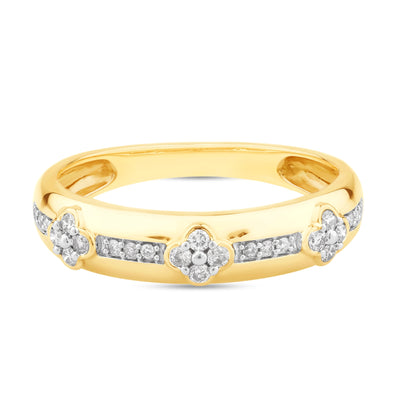 Yellow gold ring featuring a row of small round diamonds set in a channel, accented by three floral-shaped diamond clusters evenly spaced along the band.
