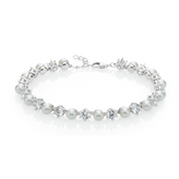 Sterling silver tennis style bracelet featuring alternating pearl and cubic Zirconias. 