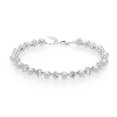 Sterling silver tennis style bracelet featuring alternating pearl and cubic Zirconias. 