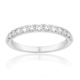 Diamond band ring with a white background