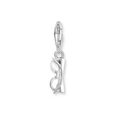 Silver charm shaped like a pair of sunglasses on a white background