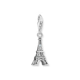 Silver Eiffel Tower charm on a white background