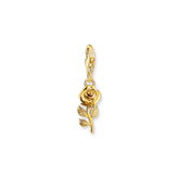 Gold plated rose charm on a white background
