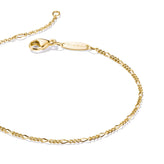 Gold chain bracelet on a white background