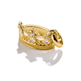 Gold Charm with stone accents on a white background
