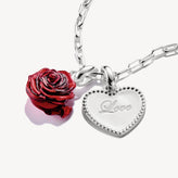 Necklace with red rose charm and heart-shaped 'Love' tag on a white background