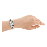 A silver-toned rectangular analog watch with a metal link bracelet, shown worn on a person's wrist against a plain white background.