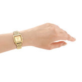 a hand in DKNY Signature Shape Watch with Gold Dial and Gold Tone Bracelet 27mm x 34mm DK1L154M0065