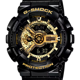 Black and gold G-Shock watch with detailed face on a white background
