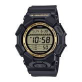 A black Casio G-Shock digital watch with a gold-tone bezel ring and black strap, shown against a plain white background.
