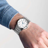 A man wears a Sekonda Analogue Watch with White Dial and Silver Tone Bracelet 40mm SK30246