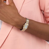 A hand in Sekonda Ladies Analogue Watch with White Dial and Two Tone Bracelet 20mm SK40125
