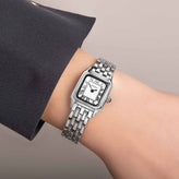 A hand in Sekonda Ladies Analogue Watch with White Dial and Silver Tone Bracelet 20mm SK40143