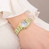 A hand in Sekonda Ladies Analogue Watch with White Dial and Gold Tone Bracelet 20mm SK40144