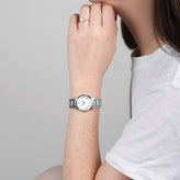 A model wears a Sekonda Analogue Watch with White Dial and Silver Tone Bracelet 28mm SK40680