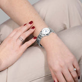 A woman wears a Sekonda Analogue Watch with White Dial and Silver Tone Bracelet 28mm SK40680