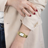 A model wears Sekonda Ladies Analogue Watch with White Dial in Gold Tone 22mm SK40694