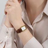 A model wears a Sekonda Ladies Analogue Watch with White Dial and Brown Leather Strap 22mm SK40695