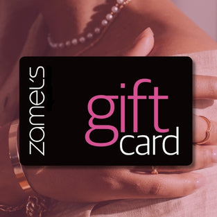Zamel's gift card held by a person with a blurred background