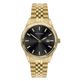 A gold-tone wrist watch with a black dial, gold-tone bezel and bracelet, and a date window at 3 o'clock, shown on a plain white background.