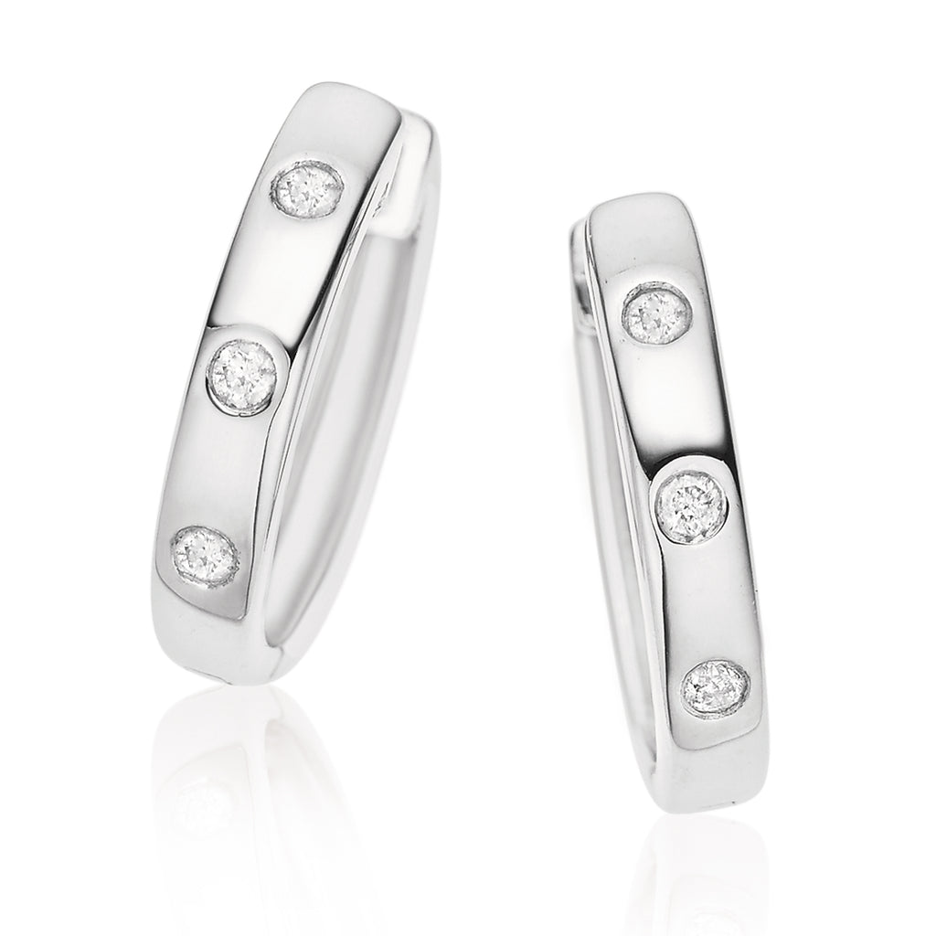 Sterling Silver Round Brilliant Cut with 0.10 CARAT tw of Diamonds  Huggie Earrings